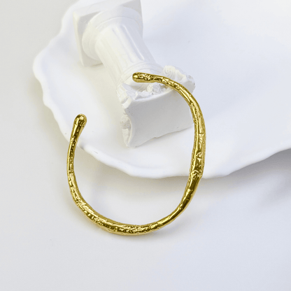 textured ripple gold cuff bracelet with hammered organic finish and adjustable open design