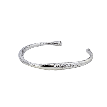 textured ripple silver cuff bracelet with polished organic finish and open adjustable design