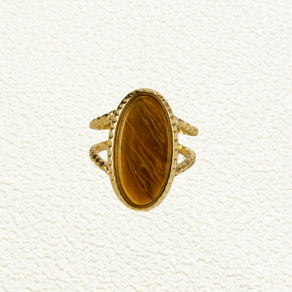 gold statement ring with large oval tiger eye stone and double textured band design.