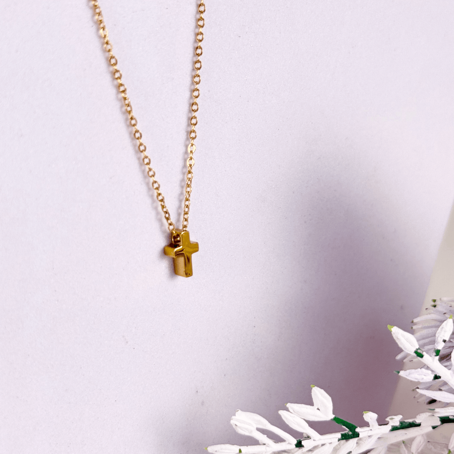 Minimalist gold tiny cross necklace on a fine chain, waterproof and tarnish-resistant