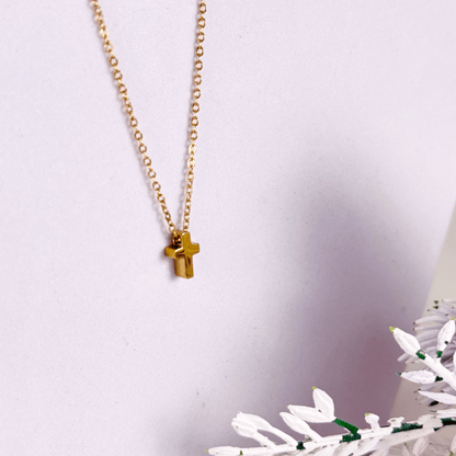 Minimalist gold tiny cross necklace on a fine chain, waterproof and tarnish-resistant