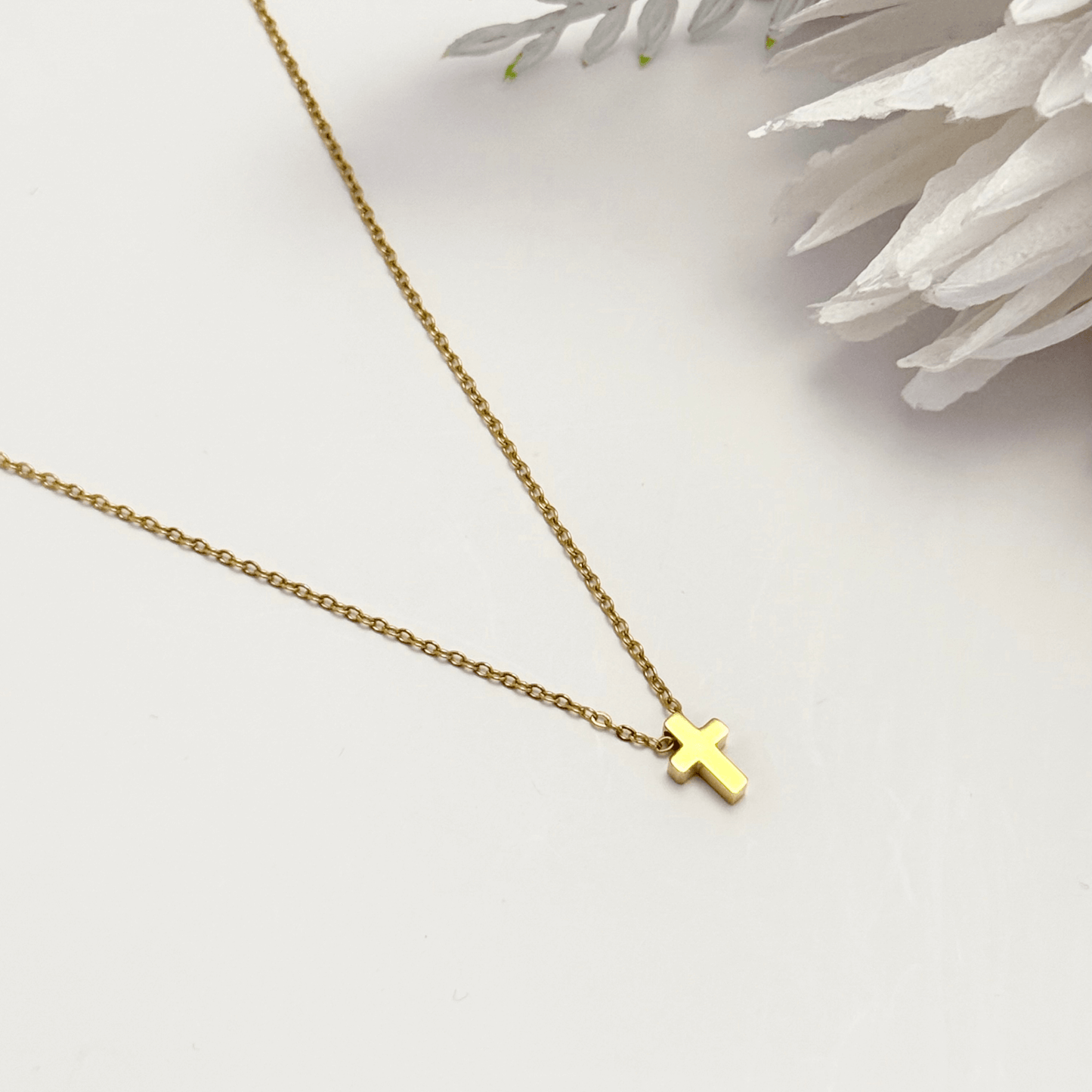 Minimalist gold tiny cross necklace on a fine chain, waterproof and tarnish-resistant