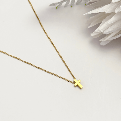 Minimalist gold tiny cross necklace on a fine chain, waterproof and tarnish-resistant