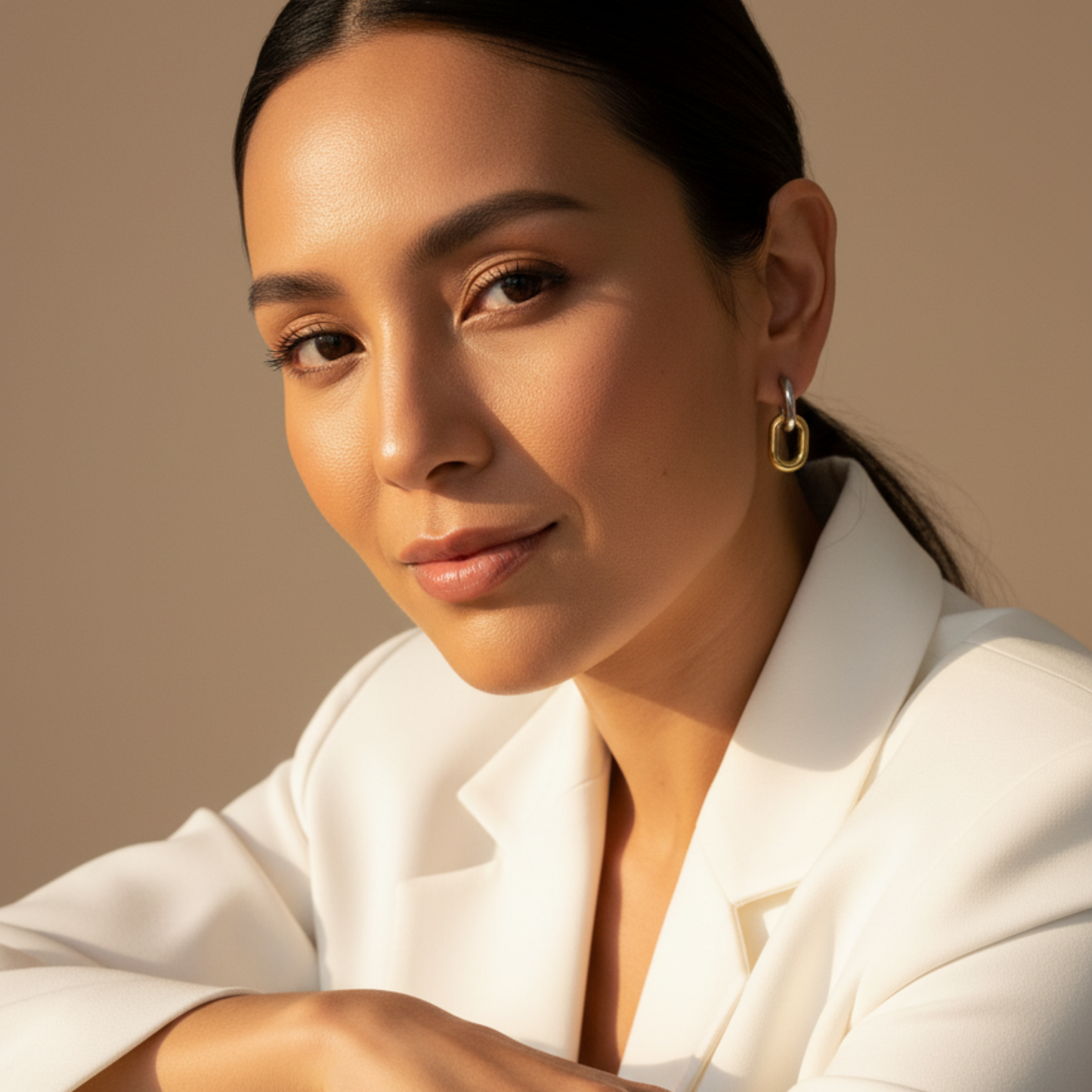 Mixed-metal link drop earrings in gold and silver.