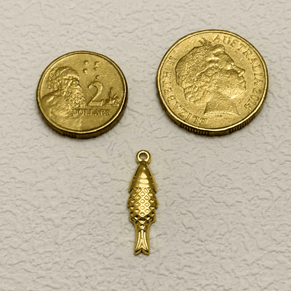 Gold vertical fish charm with diamond scale texture and detailed tail