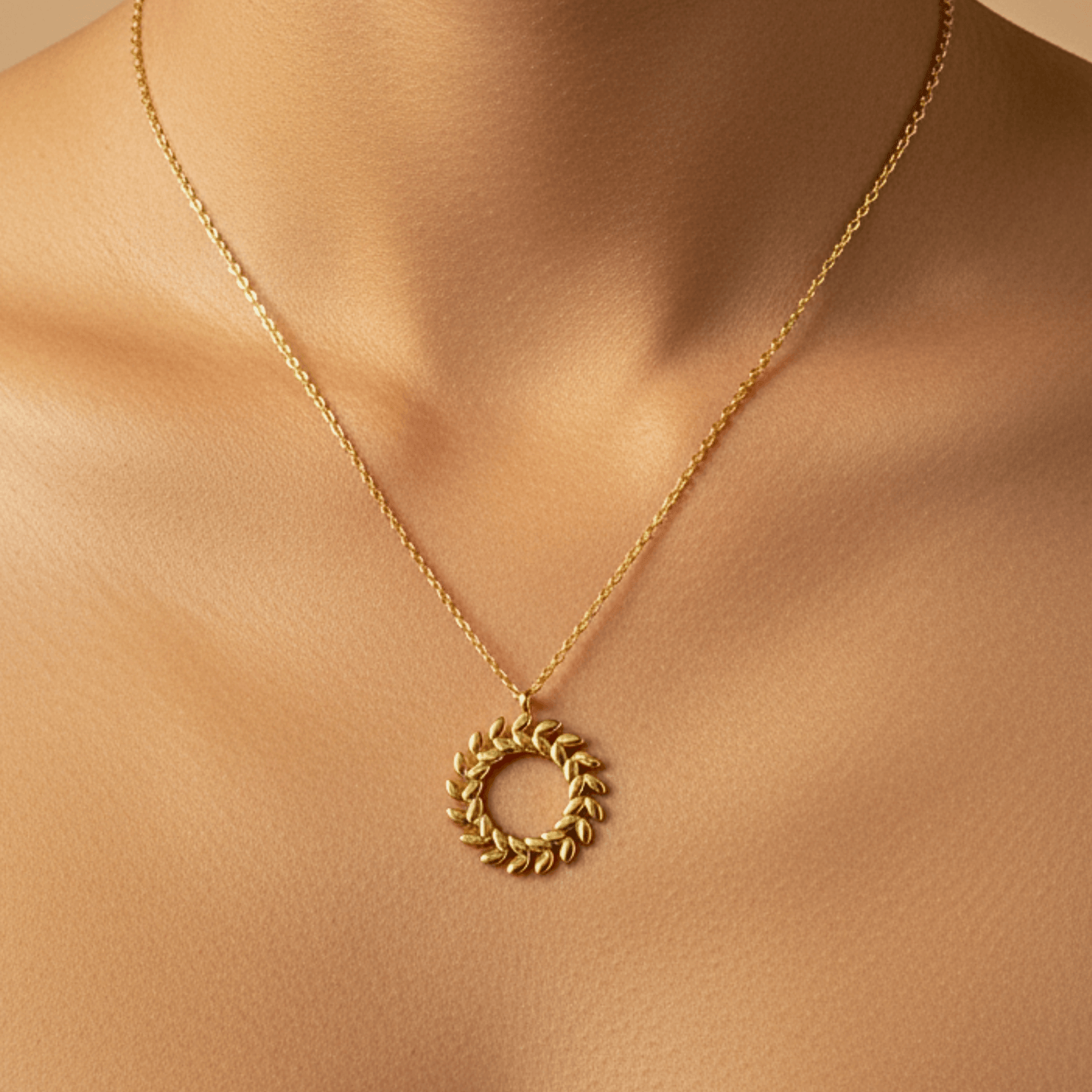 Gold laurel wreath necklace symbolising progress and resilience – MXW Jewellery
