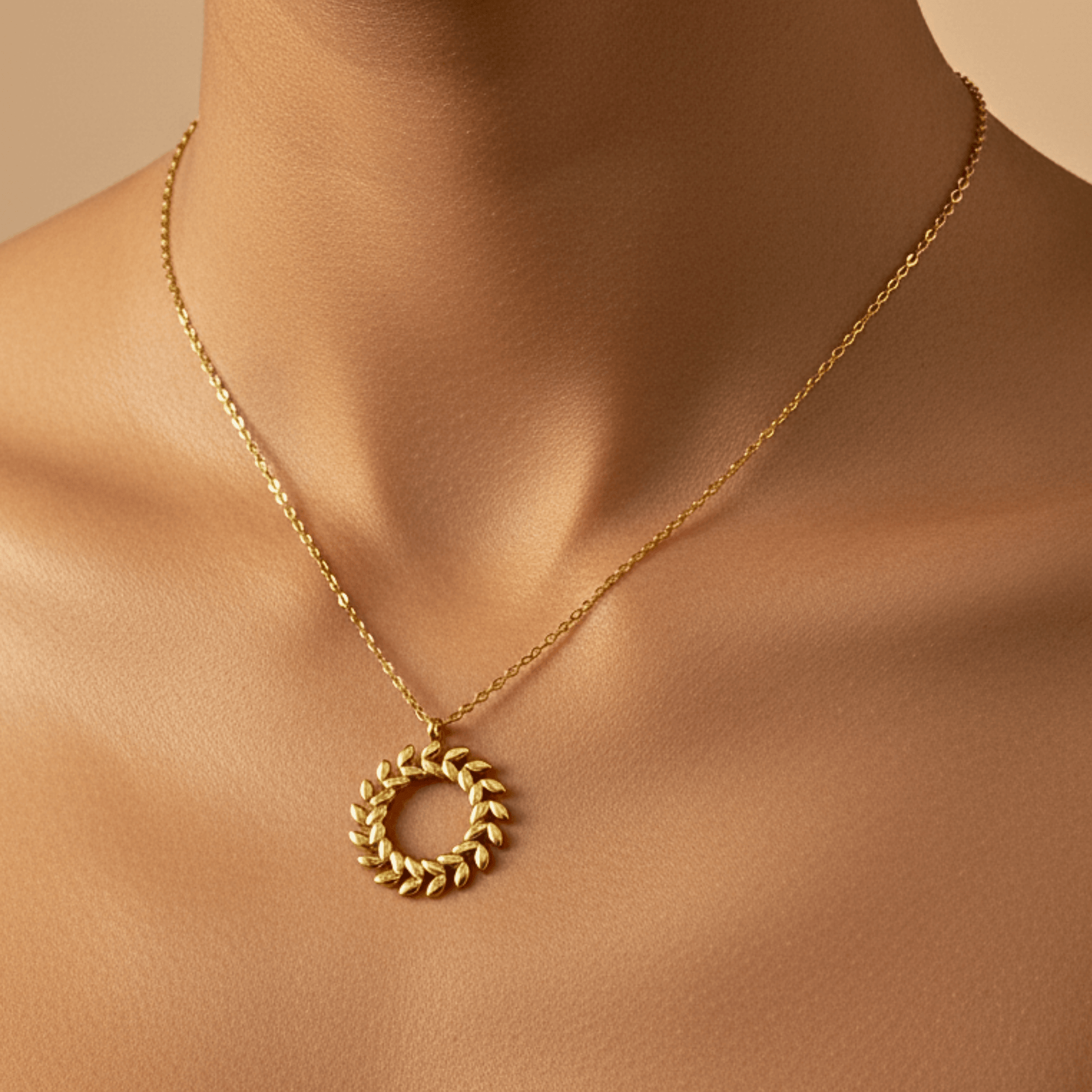 Gold laurel wreath necklace symbolising progress and resilience – MXW Jewellery