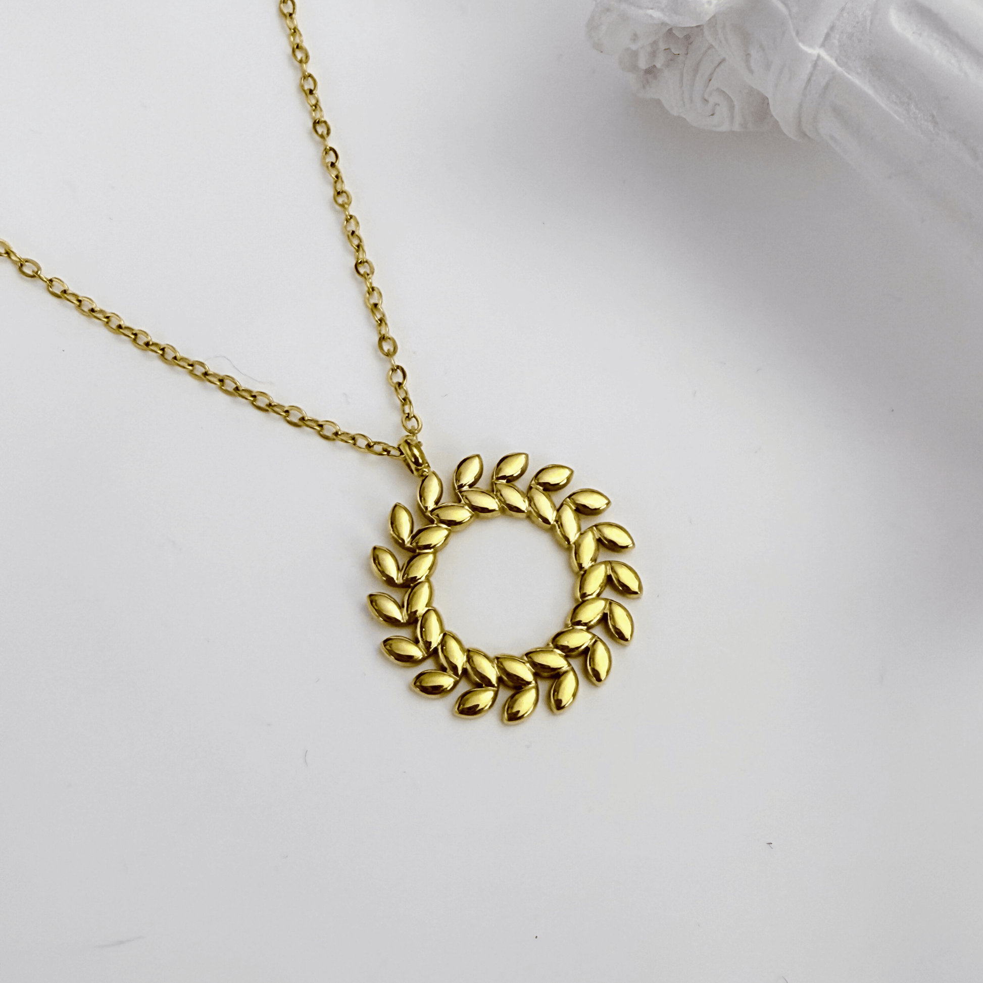 Gold laurel wreath necklace symbolising progress and resilience – MXW Jewellery