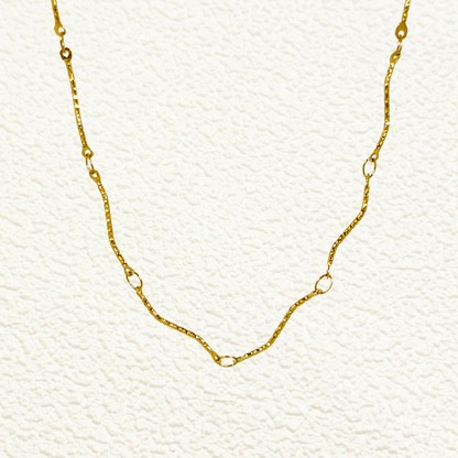 Wave Link Gold Chain made from waterproof gold PVD-plated stainless steel with textured wavy links