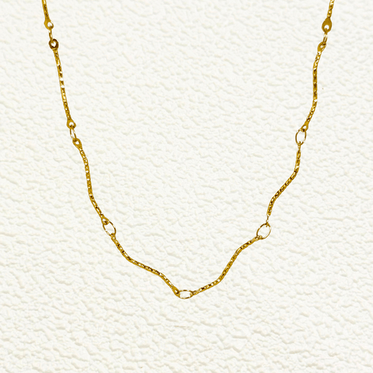 Wave Link Gold Chain made from waterproof gold PVD-plated stainless steel with textured wavy links