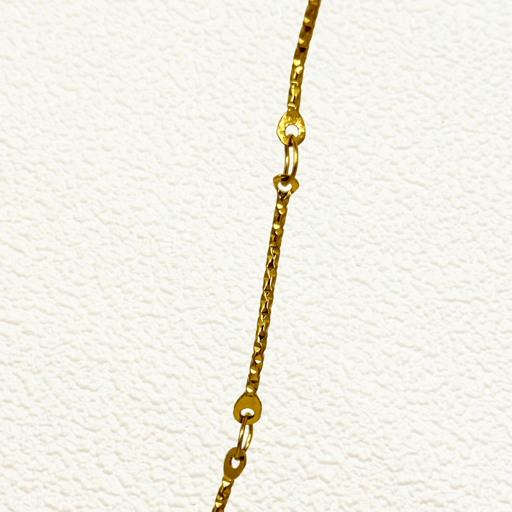 Wave Link Gold Chain made from waterproof gold PVD-plated stainless steel with textured wavy links